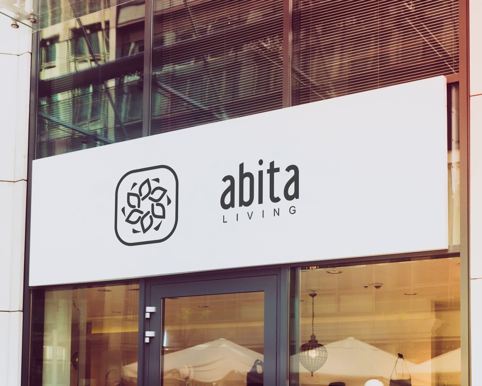 Letrero de Abita en una fachada